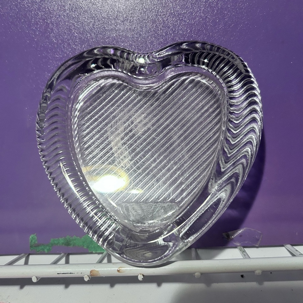 A Mikasa crystal glass heart-shaped picture frame with etched detailing. 3 by 5